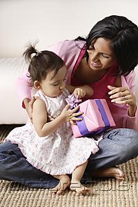 PictureIndia - woman with baby, opening her present