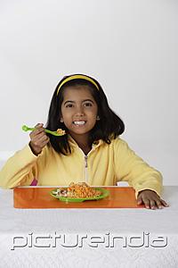 PictureIndia - Girl eating briyani rice