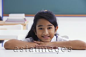Asia Images Group - female student resting chin on hands (horizontal)