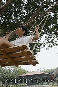 Asia Images Group - boy in swing