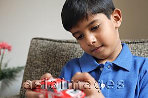 Asia Images Group - boy holding red car (horizontal)