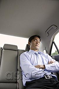AsiaPix - Businessman asleep in backseat of car