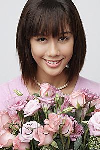 AsiaPix - Young girl with big bouquet of flowers