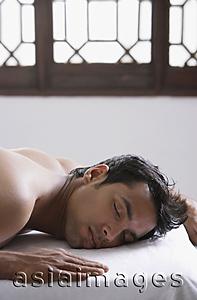 Asia Images Group - young man on massage table