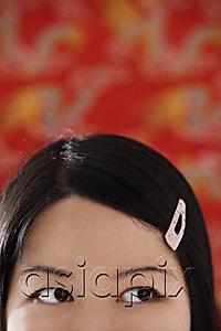 AsiaPix - Cropped face of Chinese woman with pink hair clip