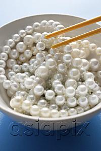AsiaPix - chopsticks picking a strand of pearls from a bowl