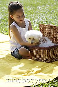 Mind Body Soul - a young girl getting a dog out of a basket