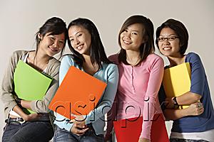 AsiaPix - Four women holding folders.