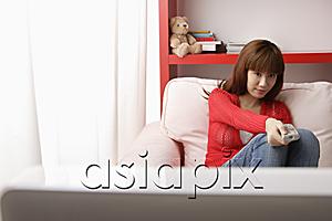 AsiaPix - Asian girl watching TV in her bedroom