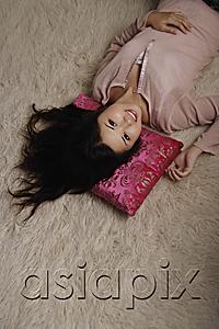 AsiaPix - Chinese woman laying on pink pillow