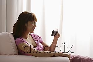AsiaPix - Asian girl reading text message