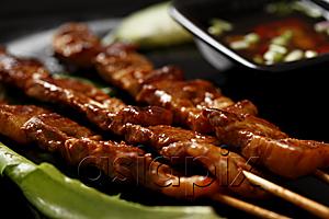 AsiaPix - Beef satay with dipping sauce.