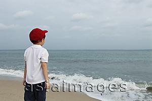 Asia Images Group - Little boy watching ocean