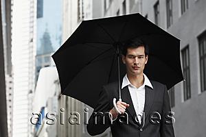 Asia Images Group - businessman holding umbrella