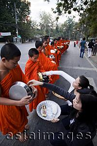 Asia Images Group - Thailand,Chiang Mai,Monks Receiving Offerings of Food