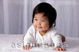 Asia Images Group - Chinese baby on tummy, smiling
