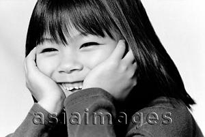 Asia Images Group - Young girl with hands on head, laughing