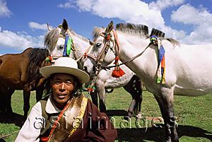 Asia Images Group - China, Szechuan (Sichuan), Kham region, Horseman with decorated horses.