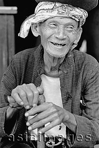 Asia Images Group - Indonesia, Java, Blitar, Elderly man holding walking stick, smiling.