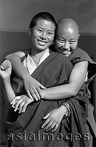 Asia Images Group - India, near Dharamsala, Dolma Ling Nunnery, Portrait of Tibetan nuns smiling.