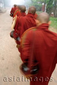 Asia Images Group - Myanmar (Burma), Bago, Novice monks collect alms early in the morning. (grainy)