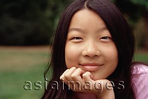 Asia Images Group - Girl with hand on chin