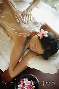 Asia Images Group - Young woman receiving massage, eyes closed