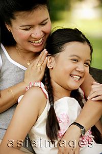 Asia Images Group - Mother hugging daughter, laughing