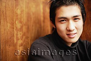 Asia Images Group - Young man looking at camera, portrait