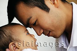 Asia Images Group - Father bonding with baby daughter