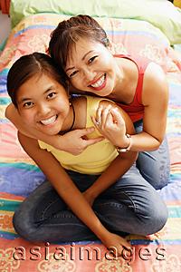 Asia Images Group - Mother hugging daughter, portrait