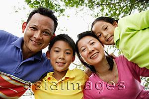 Asia Images Group - Family with two children, looking at camera
