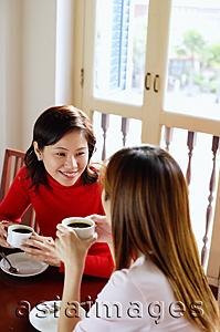 Asia Images Group - Women having coffee in cafe