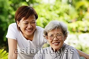 Asia Images Group - Two women, smiling at camera
