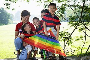 Asia Images Group - Two generation family, outdoors, smiling at camera