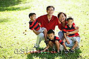 Asia Images Group - Family with three boys on field, portrait