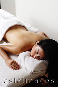 Asia Images Group - Woman lying on massage table
