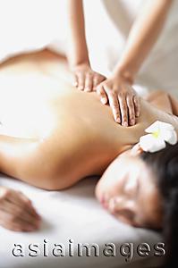 Asia Images Group - Woman undergoing back massage, selective focus