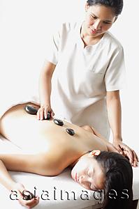 Asia Images Group - Woman receiving Lastone therapy