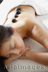 Asia Images Group - Woman relaxing with Lastone therapy massage
