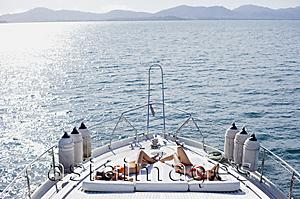 Asia Images Group - Women sunbathing on boat deck, high angle view