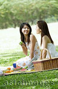 Asia Images Group - Two young women having a picnic