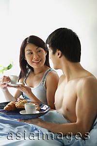 Asia Images Group - Couple having breakfast in bed
