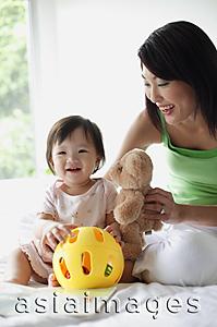 Asia Images Group - Mother with young daughter, smiling