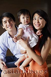 Asia Images Group - Family with one child, looking at camera, portrait