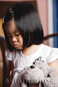 Asia Images Group - Young girl holding stuffed toy