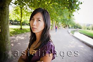 Asia Images Group - Woman looking angry in park