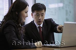 Asia Images Group - Man and woman looking at lap top