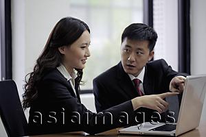 Asia Images Group - Man and woman looking at computer