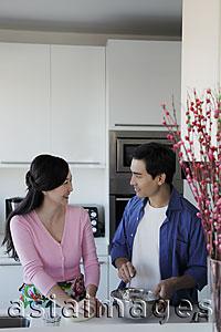 Asia Images Group - Couple cooking together in kitchen